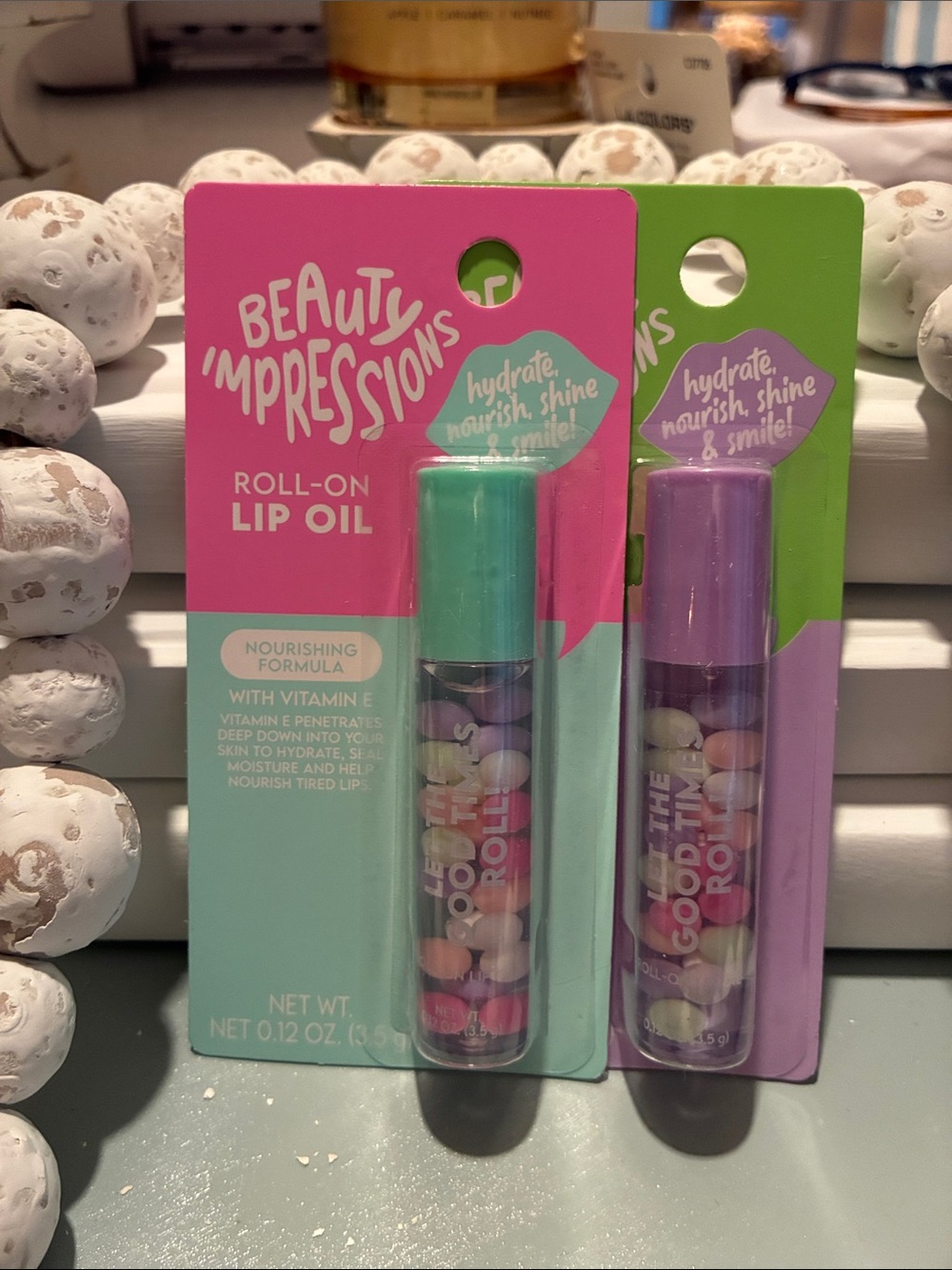 Impressions Roll-On Lip Oil Duo in Teal & Lavender Caps